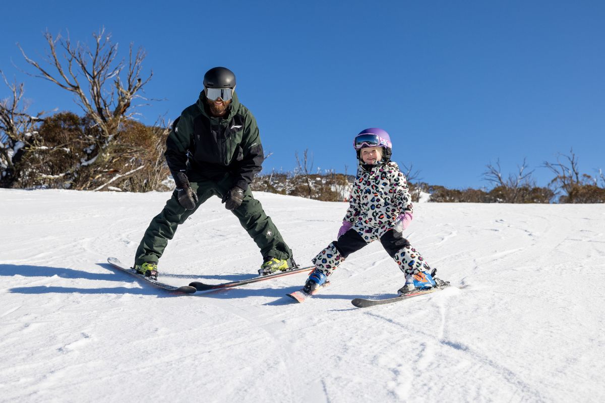 Dad and child skiing at Perisher